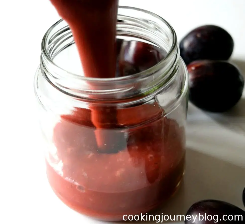 plum sauce poured in a glass jar