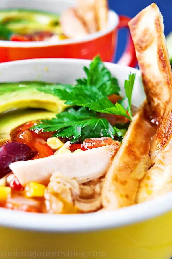 Mexican tortilla soup is easy, spicy and colorful comfy food you need to make this season! This delicious and really hot Mexican chicken soup with crunchy tortilla and creamy avocado on top will warm you and fill you up. 