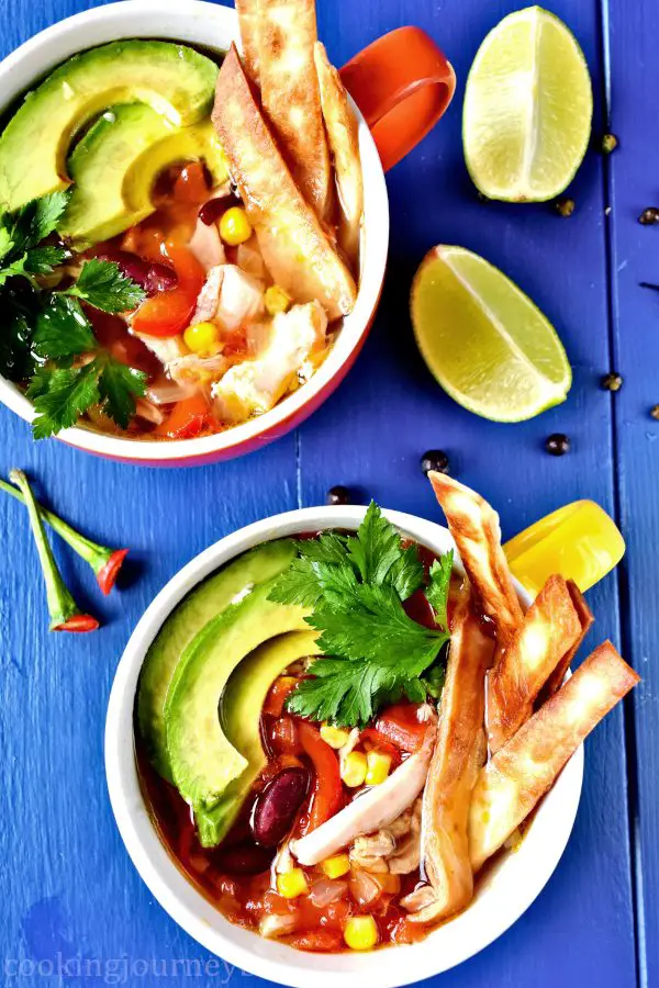 Mexican tortilla soup is easy, spicy and colorful comfy food you need to make this season! This delicious and really hot Mexican chicken soup with crunchy tortilla and creamy avocado on top will warm you and fill you up.