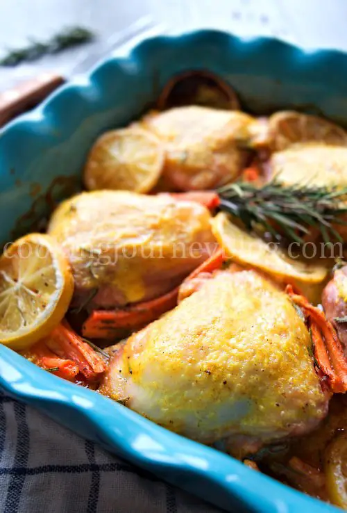 Rosemary chicken is tasty and inspiring one pot dinner to make. Chicken thighs are baked in mandarin orange sauce. Sweet and sour taste of sauce, tender rosemary chicken thighs – this dish is perfect for winter gathering with friends and family. And the color of this mandarin orange sauce is so inviting and festive! Baked chicken thighs with carrots and lemons in mandarin sauce