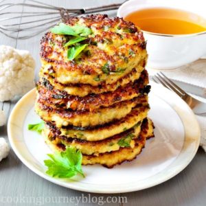 Cauliflower fritters with parsley, served on the gray table with tea. Cauliflower fritters – best cauliflower recipe for healthy breakfast. You need no milk, no sugar to make this easy pancake recipe tasty! This is one of breakfast ideas for kids, that you should try.