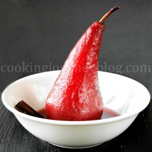 Poached pears is an easy and exquisite French dessert. This is no bake dessert, spicy poached pears in red wine. To my mind, this is one of the most beautiful pear desserts - soft fruit with spicy winter flavors. Poached pear in red wine, served on the white plate
