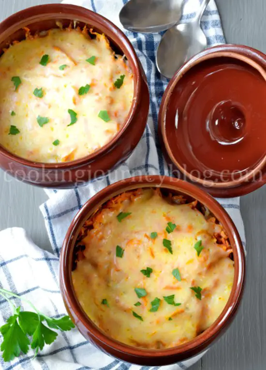 Dinner Ideas .Dinner in two clay pots. Beef and potatoes, covered with cheese and parsey.