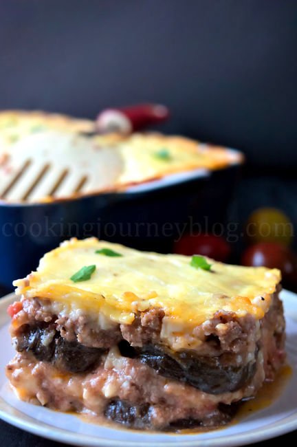 Moussaka recipe – Greek recipes - Mediterranean food . Slice of moussaka with eggplant, beef and cheese on top.