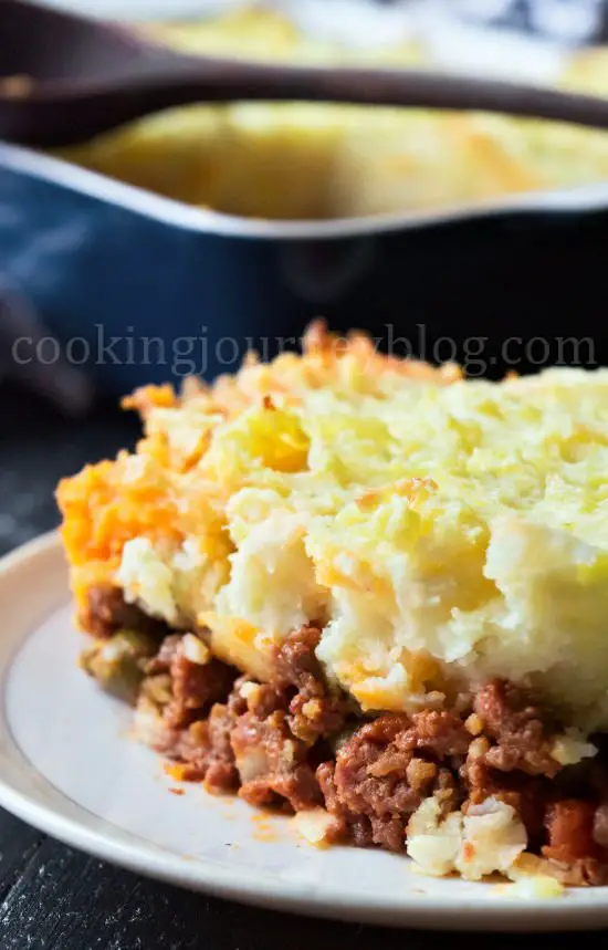 Shepherd's pie on a plate with baking tray aside