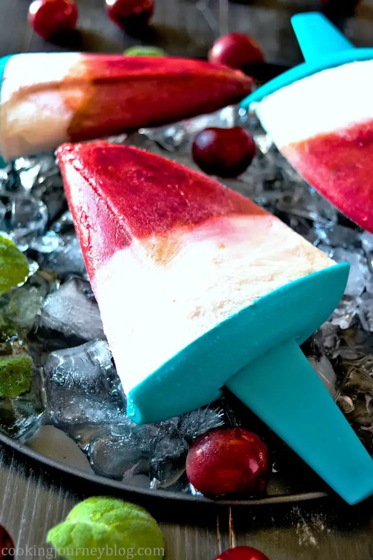 Homemade sugar free popsicles, served with ice, mint and cherries for three persons