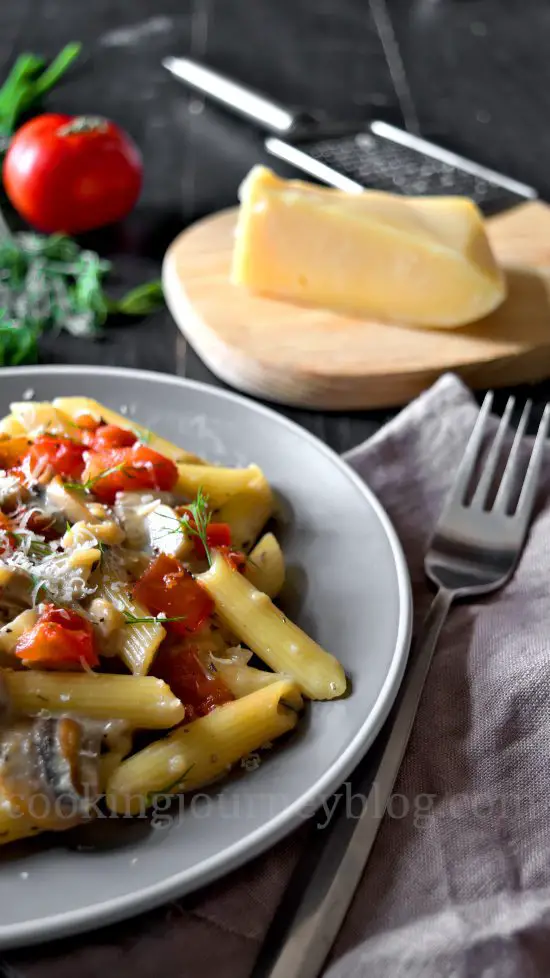 Half plate of Creamy Mushroom Pasta with Tomatoes, cheese and dill