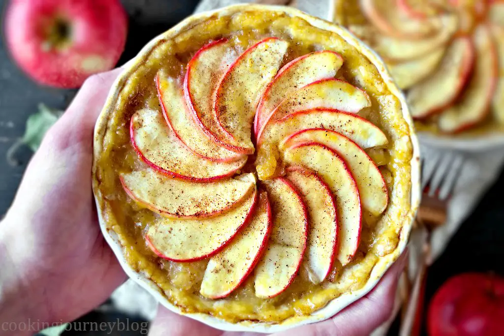 French Apple Tartlets in hands