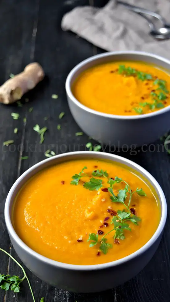 Vegan Carrot Ginger Soup in grey bowls