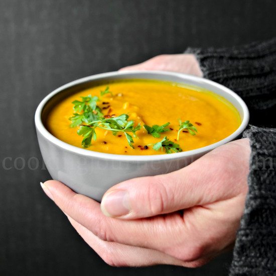 Vegan Carrot Ginger Soup in hands