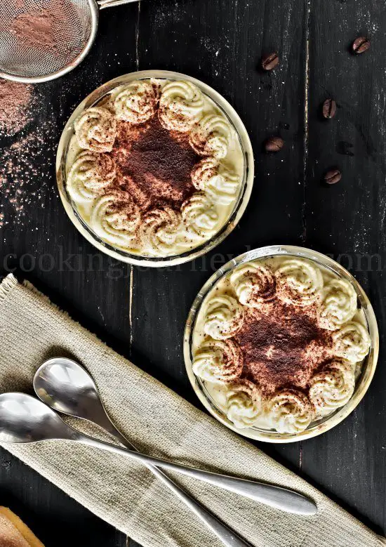 Easy tiramisu recipe, individual coffee desserts, decorated with cocoa powder, view from top