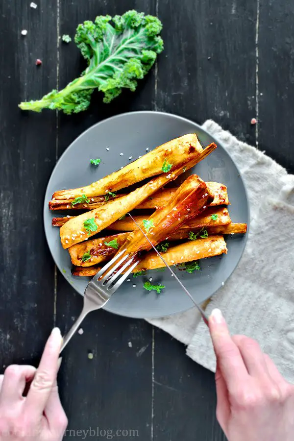 Honey Roasted Parsnips with fork and knife