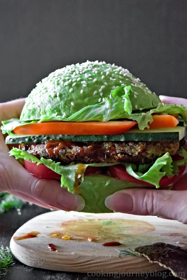 Holding vegan avocado burger