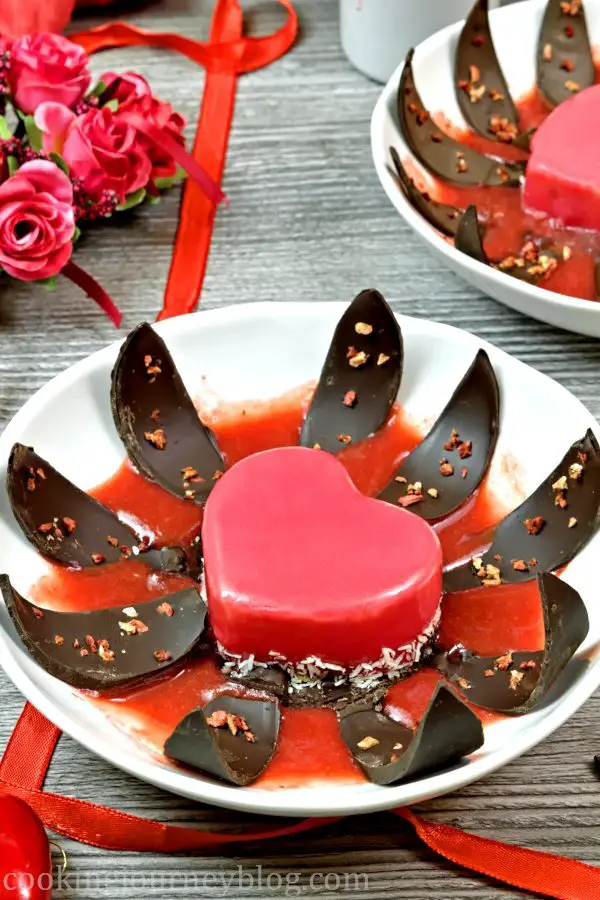 Mirror glaze cake. Blooming chocolate dessert with strawberries for Valentine's day.