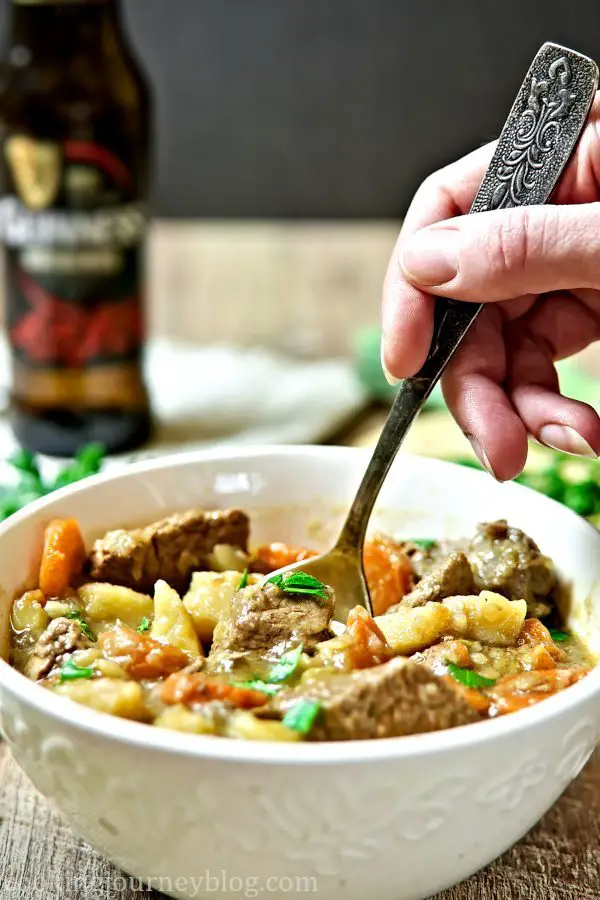 Irish Beef stew, served with parsley, garlic and a spoon