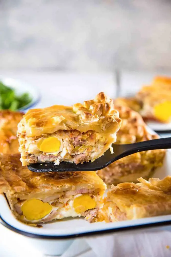 Bacon and Egg Pie slice on a spatula