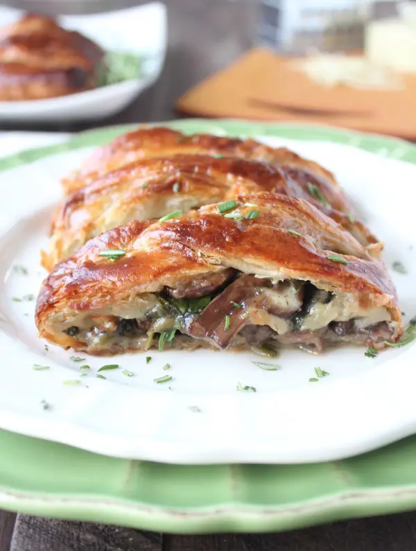 Cheesy Mushroom Spinach Puff Pastry on  awhite plate