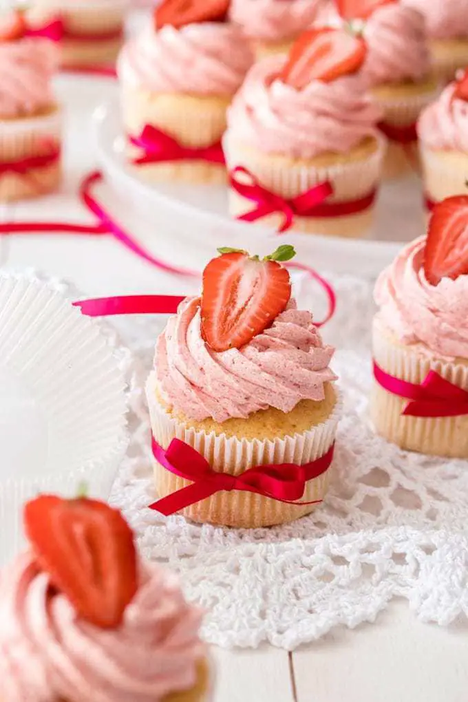Vanilla Cupcakes with strawberry cream and strawberry on top