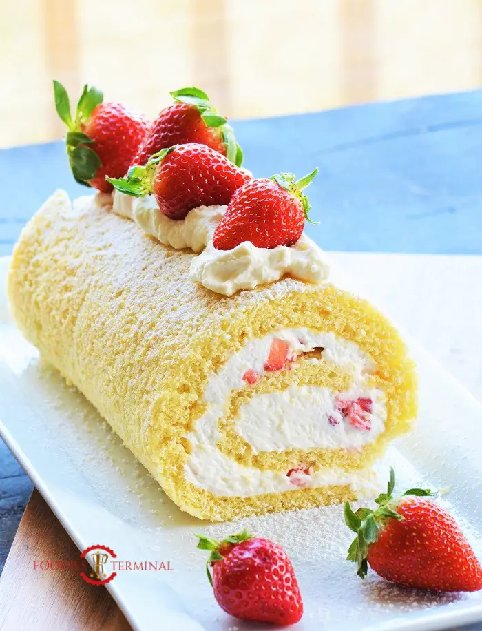 Vanilla Swiss Roll Cake Recipe with strawberries on top