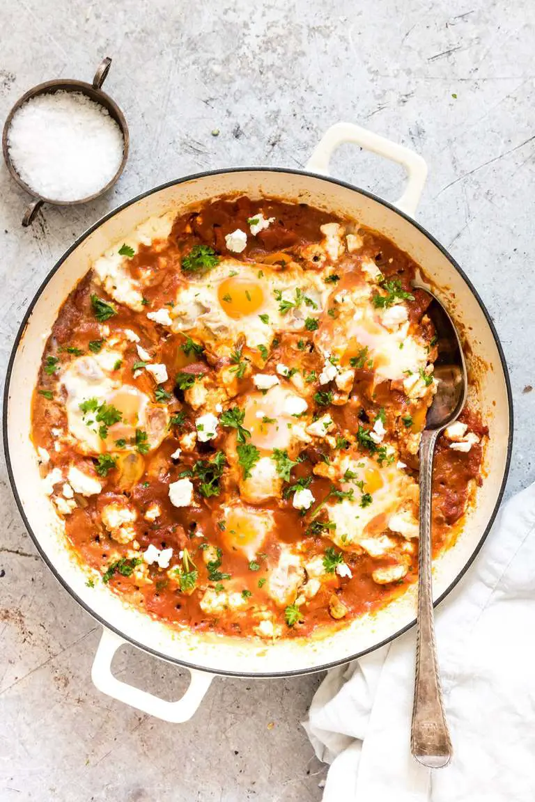Shakshuka with a spoon, view from top