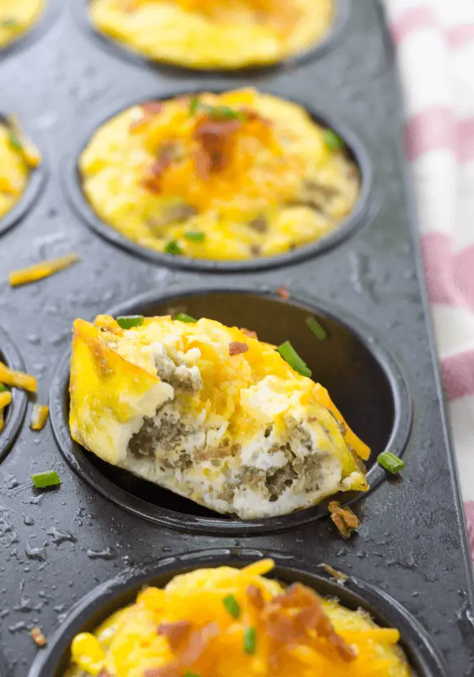 Bite of egg muffin in a muffin pan