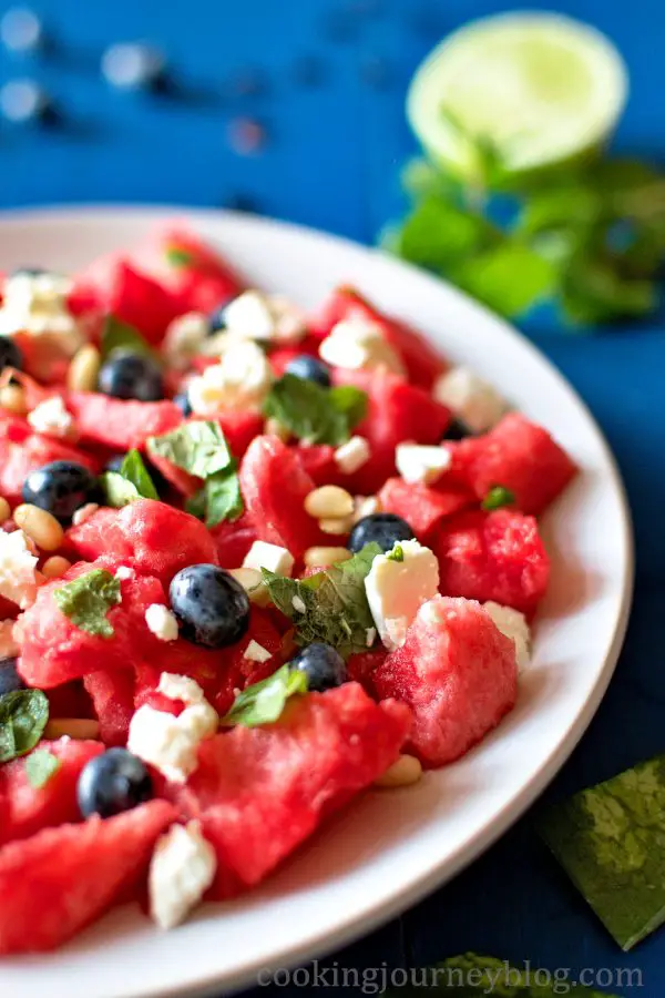 Watermelon with feta, blueberries, pine nuts, mint and lime juice
