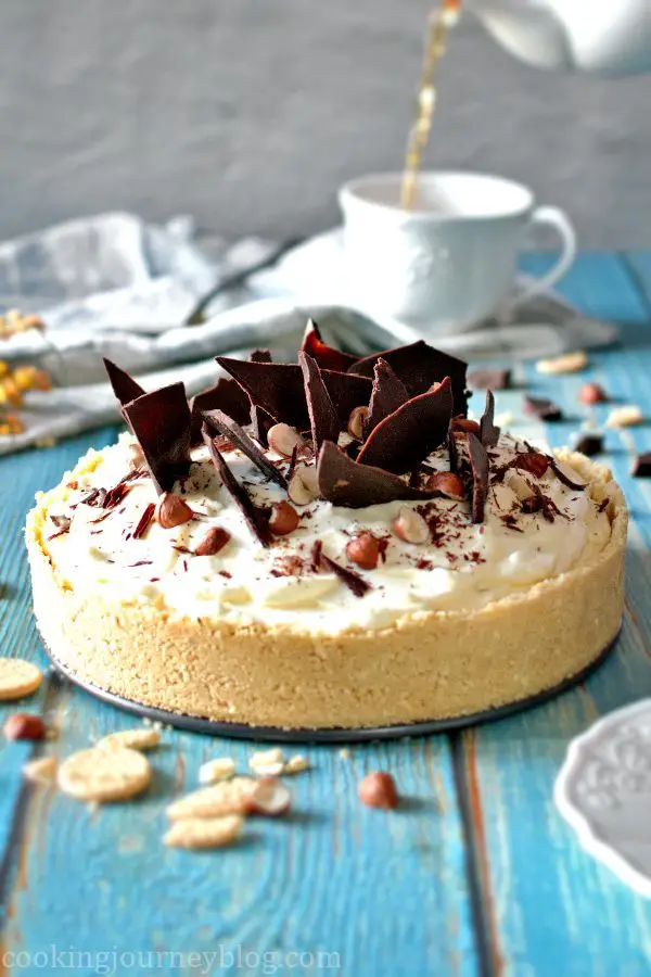 No Bake Banoffee Pie, decorated with chocolate and served with a cup of tea.