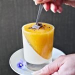 Eating Persimmon panna cotta with a spoon