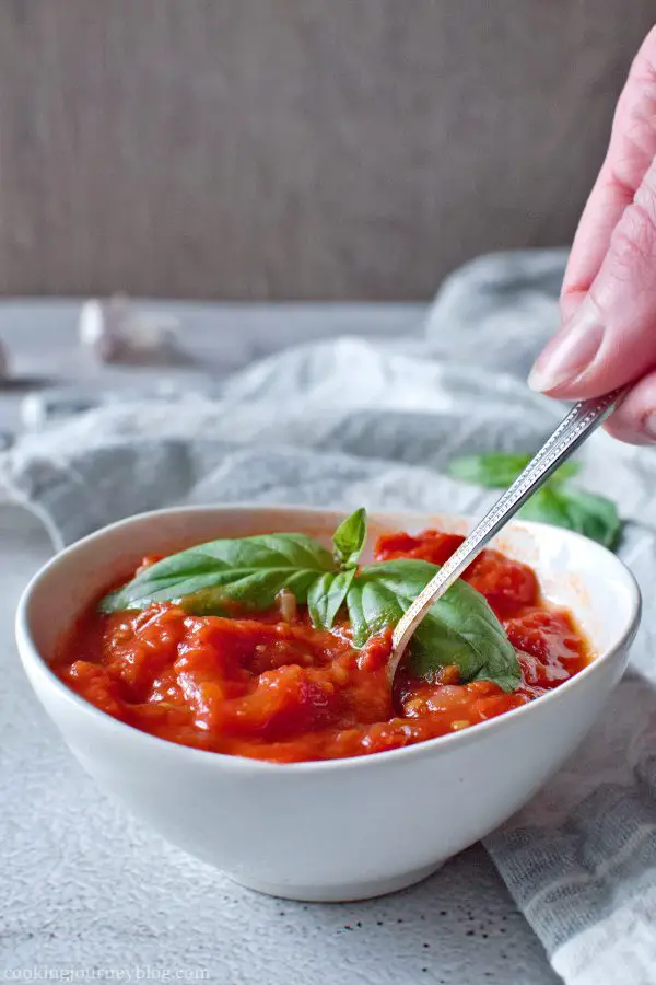 Homemade marinara sauce on the spoon