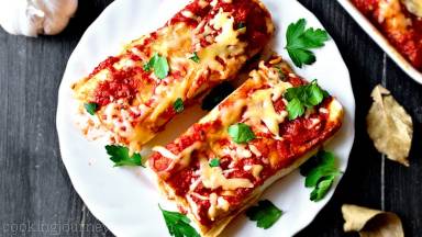 Let chicken enchiladas cool 5 minutes before serving. Add more parsley and yogurt on top, if you wish.