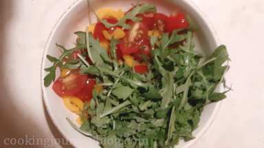 Add rocket leaves to salad and gently combine with other ingredients.