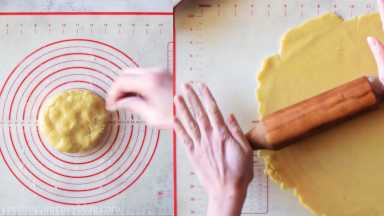 Roll the bottom crust of the pie. Use the rolling pin and roll on lightly floured flat surface.
