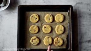Transfer the cookies to the baking tray, layered with parchment paper. Leave the space between the cookies. Cut the cross on each cookie. Bake 15-20 minutes until golden.