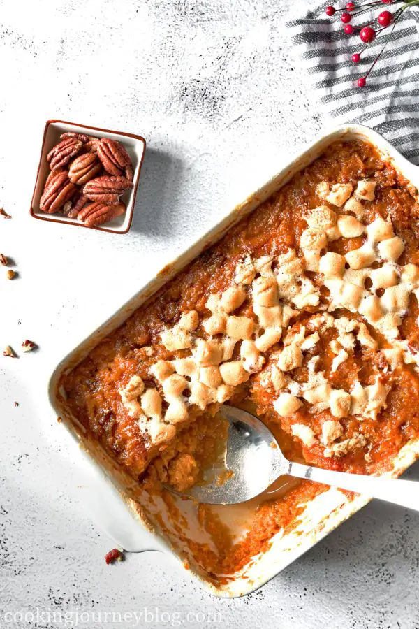 Sweet Potato Casserole with a serving spoon