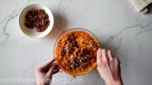Crush half of pecans with hands or knife. Mix in the sweet potato mash.