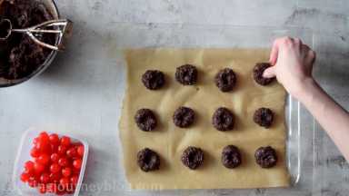Using your thumb, make a well in the center of each cookie.
