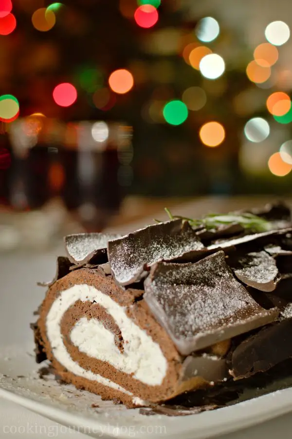 Buche de Noel - Yule Log Cake, served on Christmas table