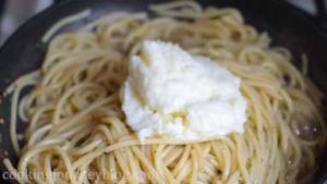 Remove the pan from heat and add Pecorino sauce. Mix well with spaghetti.