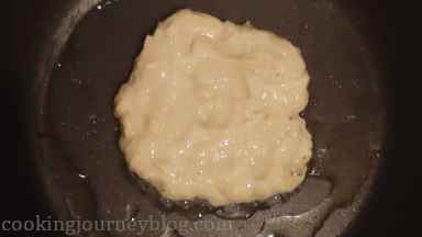 Add 1 tablespoon of potato batter and with a back of the spoon form a round shape.