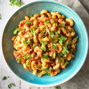 Easy American Chop Suey recipe - a blue plate with macaroni and beef
