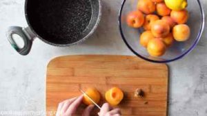 Cut apricots in half, remove the pit and stem. Then cut in quarters and place in the heavy bottom pan.