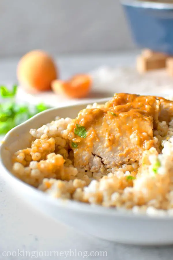 Cut apricot chicken in a bowl with barley