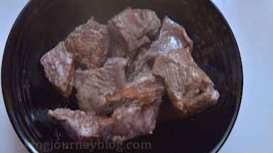 Place browned pieces of meat on a plate and repeat with remaining beef until all is browned. Add more oil, if needed before browning second or third batch.