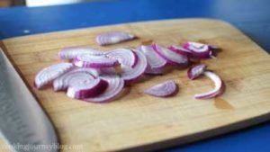 Cut onion in half, then thinly slice it.