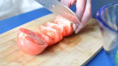 Chop tomato into thick slices.