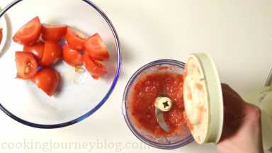Blend raw tomatoes in a blender or food processor.