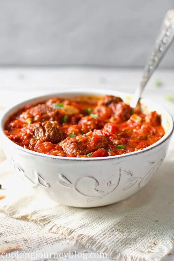 African beef stew served with a spoon