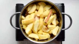 Add all spices in a pot. Stir together, so the apples are covered.