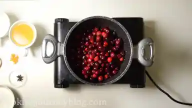 Prepare a middle size pot. Put cranberries first.