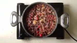 Bring the pot to the boil. Cranberries will start to pop.